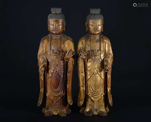 A PAIR OF GILT-LACQUERED WOOD FIGURE OF