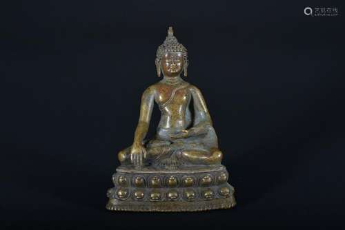 A BRONZE FIGURE OF SHAKYAMUNI.MING PERIOD