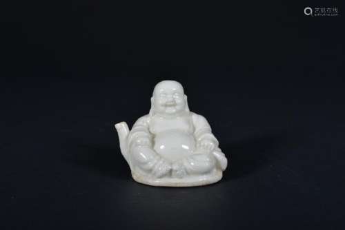 A CARVED WHITE-GLAZED 'BUDDHA' WATERPOT.TANG PERIOD