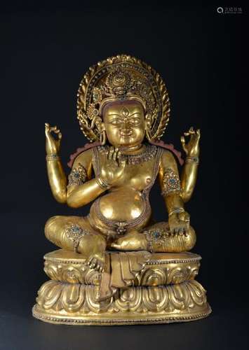 A LARGE GILT-BRONZE FIGURE OF KUBERA.YUAN PERIOD