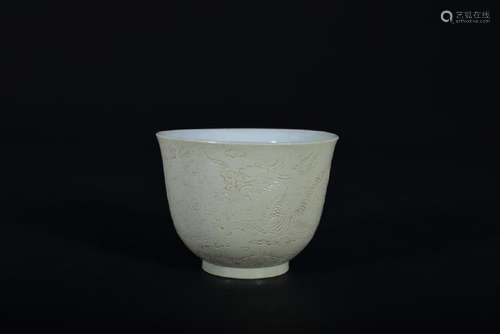 A CARVED WHITE-GLAZED 'DRAGON' CUP .QING PERIOD