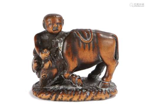 Japanese Meiji period signed netsuke, the wood netsuke depicting Boy with Ox, the boy appearing to
