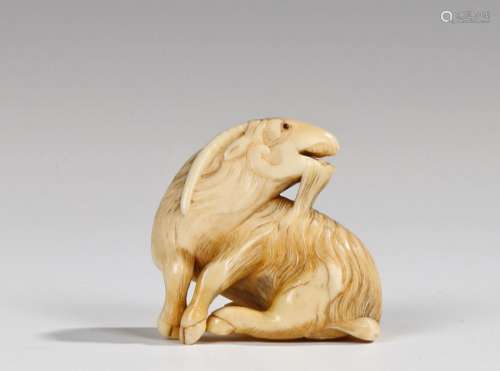 Fine Japanese Edo period netsuke, the ivory netsuke carved as a Kyoto goat, seated and looking to