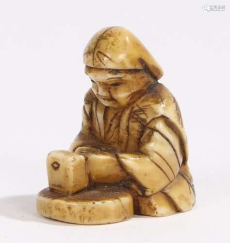 Japanese Meiji period ivory netsuke, of small proportions, of a seated figure, 2.5cm high