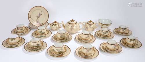 Japanese porcelain tea service, each trio with individual foliate decoration, consisting of twelve