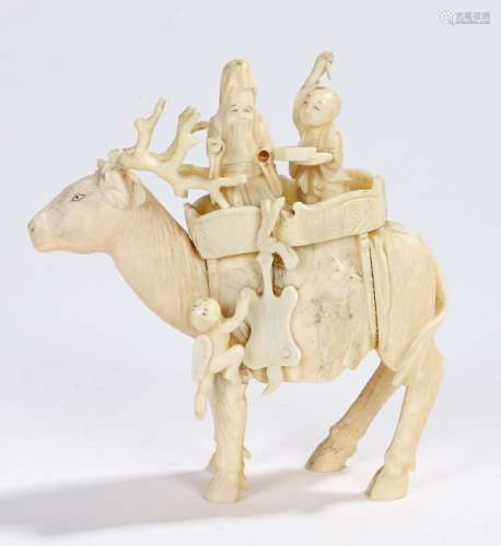 Japanese Meiji period ivory group, of a scholar and figure riding a large stag, 13cm long