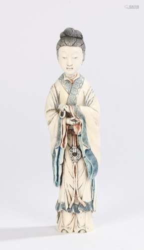 Japanese Meiji period ivory okimono, the standing figure with folding arms and long robes, with blue