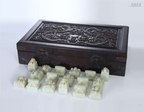 A SET OF CHINESE CELADON JADE DRAGON SEALS IN ROSEWOOD CASE