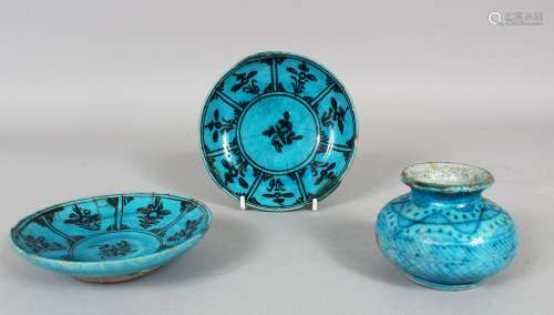 TWO 16TH CENTURY PERSIAN KUBACHI POTTERY SAUCERS and ink pot, saucer 13cm diameter, pot 6cm high.