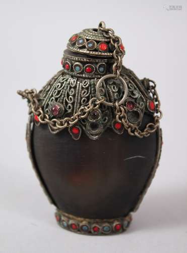 A 19TH CENTURY SINO - TIBETAN HORN AND INLAID SNUFF BOTTLE, the body of the snuff bottle formed from