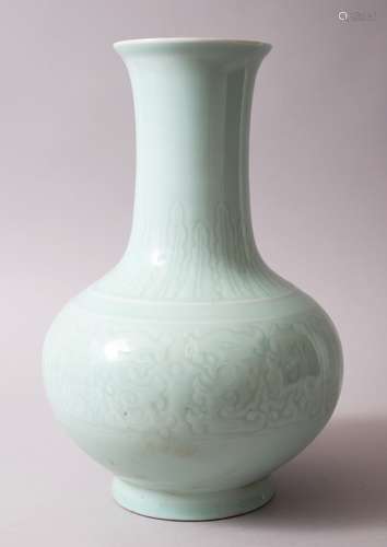 A CHINESE CELADON GROUND & MOULDED QIANLONG STYLE PORCELAIN BOTTLE VASE, with moulded panels of