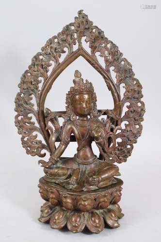 A 20TH CENTURY TIBETAN BRONZE DEITY / BUDDHA, seated upon a lotus form base, in a meditation pose,