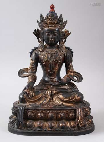 A CHINESE GILT BRONZE FIGURE OF A BUDDHA, seated upon a lotus formed base in a meditating position,