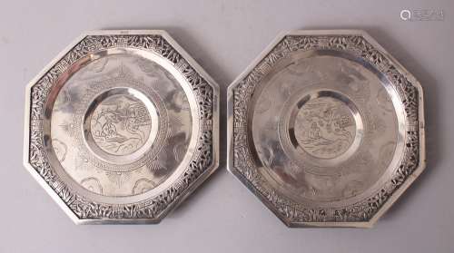 A PAIR OF CHINESE SOLID SILVER DISHES, the dished with carved and pierced outer decoration depicting