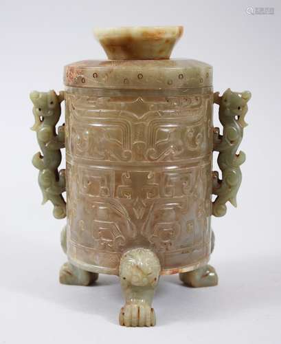 A GOOD CHINESE CARVED JADE JAR AND COVER, with carved decoration of geometric style, with twin