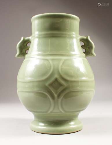 A CHINESE CELADON PORCELAIN RIBBED HU VASE, the base with a six-character mark to base, 20.8cm