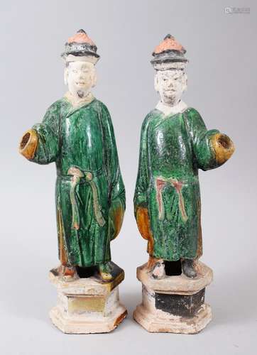 A GOOD PAIR OF LARGE MING DYNASTY SANCAI POTTERY TOMB FIGURES, the figures with removable heads,