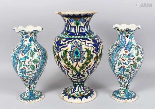 THREE 19TH CENTURY OTTOMAN TURKISH KUTAHIYA VASES, large vase 32cm high, pair of vases 26cm high.