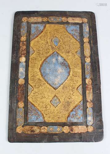 AN EARLY 16TH CENTURY PERSIAN SAFAVID QURAN BINDING, blue and gold motif, 36cm x 23cm.