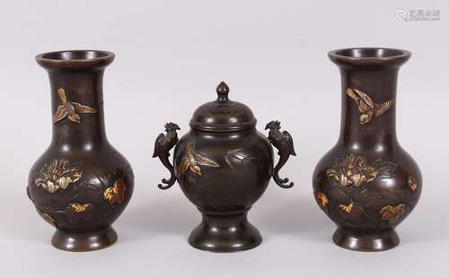 A GOOD GARNITURE OF JAPANESE BRONZE AND MIXED METAL, consisting of a pair of vases and a koro, all