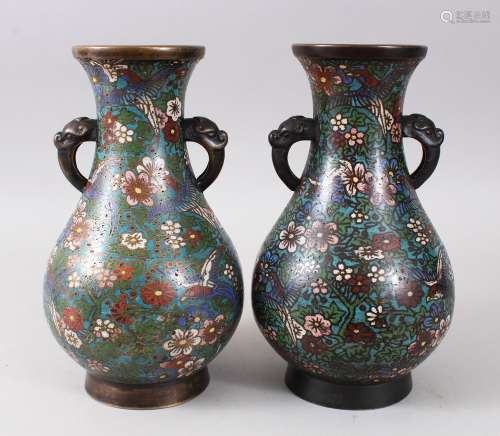 TWO CHINESE TWIN HANDLE CLOISONNE VASES, both decorated with scenes of birds flying amongst native