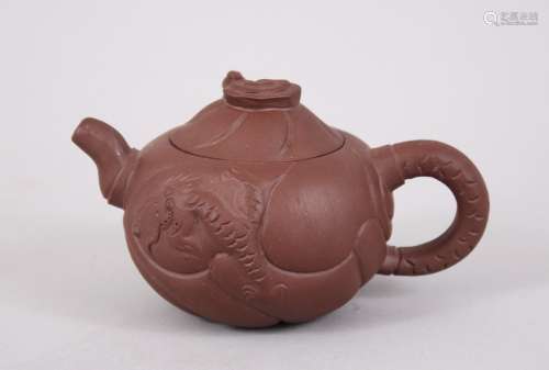 A 20TH CENTURY CHINESE YIXING TEAPOT AND COVER, the lid with a moving dragons head, the body with