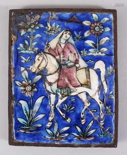 A GOOD EARLY IZNIK TILE, a young lady on a horse, 21cm x 16cm.