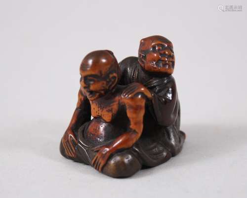 A GOOD JAPANESE EDO PERIOD WOOD & LACQUER NETSUKE OF BLIND MASSEUR, the blind masseur working, the