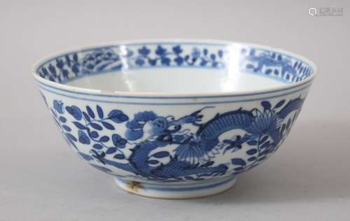 A 19TH CENTURY CHINESE BLUE & WHITE DRAGON BOWL, decorated with external scenes of dragons amongst