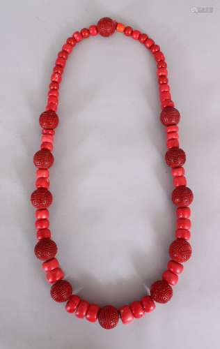 A GOOD 20TH CENTURY CHINESE CINNABAR LACQUER & RED CORAL NECKLACE, of larger than average size,