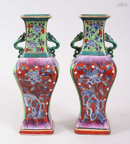 A PAIR OF 18TH CENTURY KANGXI CHINESE BLUE & WHITE CLOBBERED PORCELAIN VASES, decorated in a variety