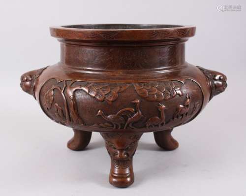 A LARGE CHINESE BRONZE TRIPOD CENSOR, with pressed decoration panels depicting scenes of deer and