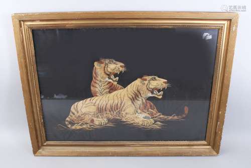 A JAPANESE MEIJI PERIOD EMBROIDERED SILK PICTURE OF TIGERS, the gilt framed picture depicting two