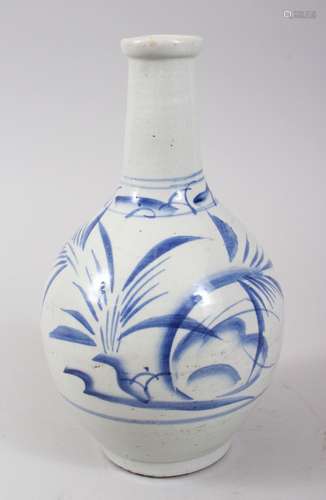 A JAPANESE MEIJI PERIOD BLUE & WHITE ARITA PORCELAIN BOTTLE VASE, decorated with sprays of