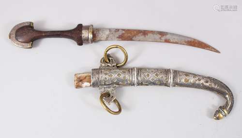 A PERSIAN DAGGER with a wooden handle in a silver and brass sheath, 40cm long.