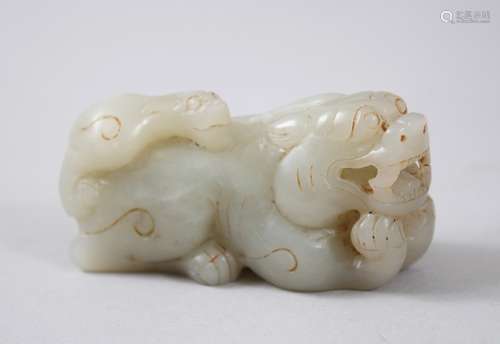 A GOOD 18TH / 19TH CENTURY CARVED JADE / NEPHRITE KYLIN, carved bearing its teeth with young upon