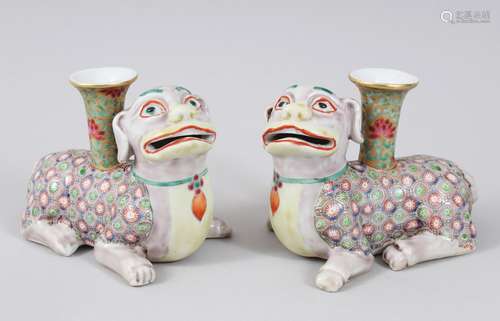 A PAIR OF 19TH CENTURY CHINESE EXPORT CANTON PORCELAIN DOG CANDLESTICKS, modeled as recumbent lion