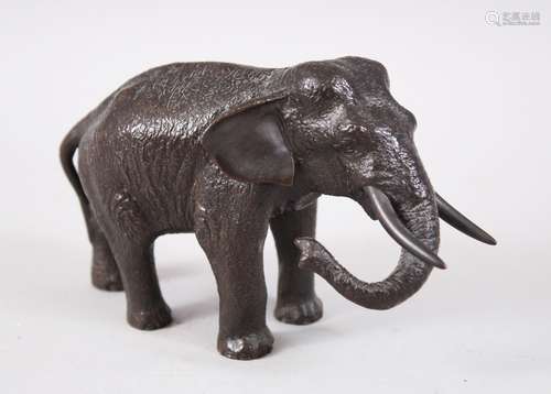 A GOOD JAPANESE LATE MEIJI PERIOD BRONZE ELEPHANT OKIMONO, the elephant in striding position, the