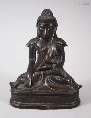 A 19TH CENTURY BURMESE BRONZE BUDDHA, seated in meditation position, 15cm high x 12cm wide.