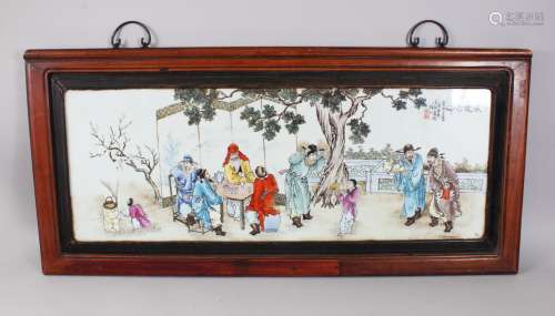 A 20TH CENTURY CHINESE FAMILLE ROSE REPUBLIC STYLE FRAMED PLAQUE, the plaque depicting scenes of