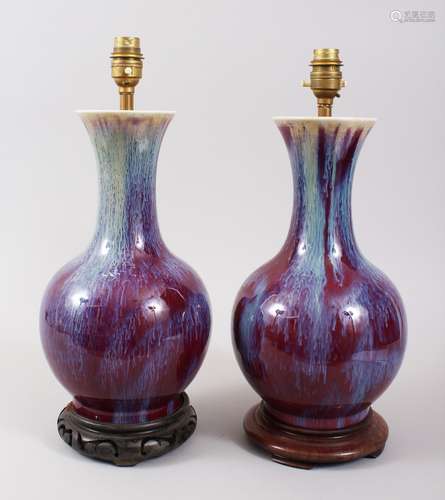 A PAIR OF 19TH CENTURY CHINESE SANG DE BOEUF / FLAMBE PORCELAIN VASES CONVERTED TO LAMPS, with