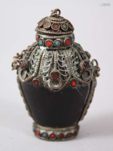 A 19TH CENTURY SINO - TIBETAN HORN AND INLAID SNUFF BOTTLE, the body of the snuff bottle formed from