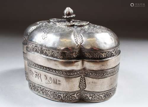 AN 18TH CENTURY MUGHAL INDIAN SILVER SHAPED BOX AND COVER, inscription on the front, 13cm long,