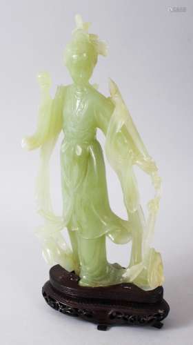 A GOOD 19TH / 20TH CENTURY CHINESE CARVED JADE FIGURE OF GUANYIN, stood in traditional robes and