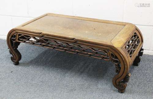 A GOOD 19TH CENTURY CHINESE HARDWOOD OPIUM / LOW TABLE, with curving sides met by a carved and