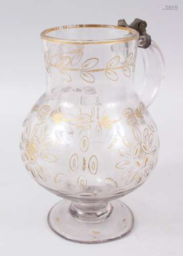 A 19TH CENTURY OTTOMAN TURKISH BEYKOZ GLASS JUG with gilt decoration, 23cm high.