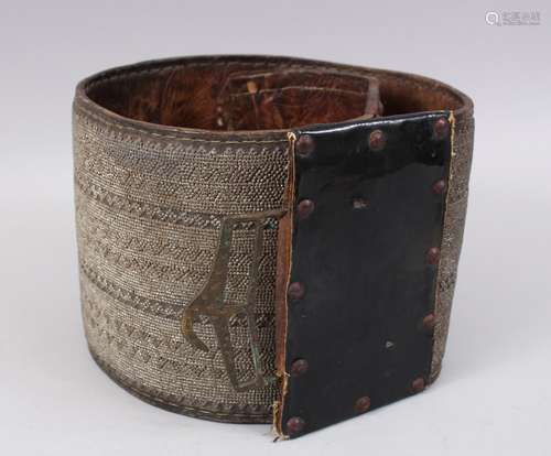 A VERY LARGE 19TH CENTURY OMANI OR YEMENI SILVER INLAID LEATHER CEREMONIAL BELT, 18cm deep x 112cm