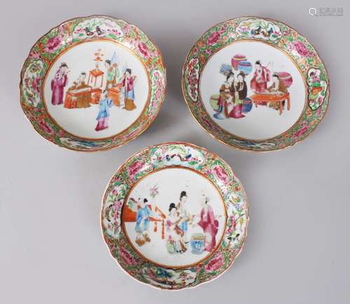 THREE 19TH CENTURY CHINESE CANTON FAMILLE ROSE PORCELAIN BOWLS, each with a central painting of