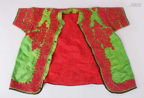 A 20TH CENTURY CHINESE EMBROIDERED SILK OR TEXTILE CHILD'S ROBE, green ground with red embroidery,