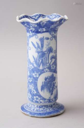 A JAPANESE MEIJI PERIOD BLUE & WHITE SCALLOPED RIM PORCELAIN VASE, with various panels of native